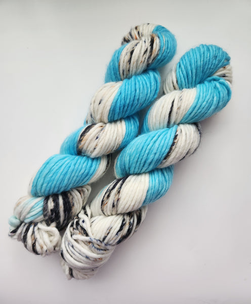 Light blue yarn with black speckles